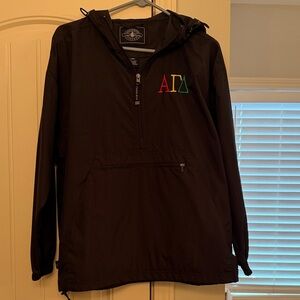 Alpha Gamma Delta embroidered windbreaker. Half zip with front zipper pocket